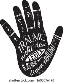 Lettering in a hand silhouette. Black and white graphics. German quote.  Don’t dream your life, live your dream. Träume nicht dein Leben, lebe deinen Traum.