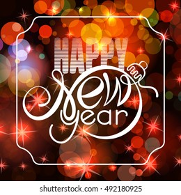 Lettering Happy New year on bokeh background. Shape of text same as Xmas ball.