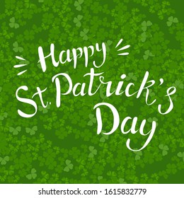 Lettering Happy st. Patrick day in  green shamrock and clover background