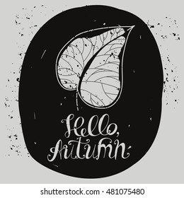 Lettering "Hello Autumn". The inscription and the natural elements. The leaves and berries. Autumn leaf. Vintage style. The oval frame.