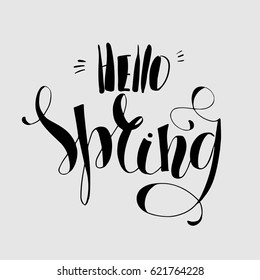 Lettering "Hello Spring." Hand writing. Light on the dark. Calligraphy