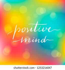 Lettering inscription positive mind. Motivating quote. Vector lettering on blurred lights background.