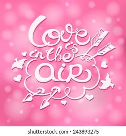 Lettering "Love is in the Air". Positive bright pink shimmering background. Decorated with birds, hearts and cupid`s arrows. Template for Valentine`s Day card, invitation, poster, label.