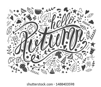 Lettering phrase hello autumn in a doodling style in black on a white background