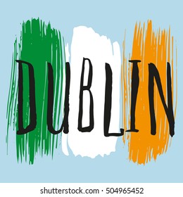 Lettering poster for your design. Creative typography. Hand drawn greeting card with text Dublin. Tourism and travel. Irish flag background. Brush strokes.