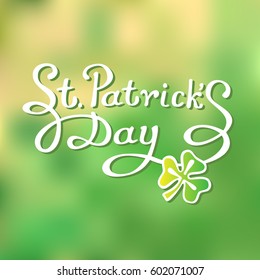Lettering: St. Patrick's Day on green blurred background. Vector image for your design. 