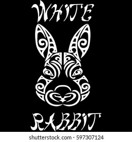 Lettering White Rabbit with a rabbit head stylized Maori face tattoo.