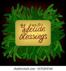 lettering yuletide blessings, decorated with green pine-tree branches