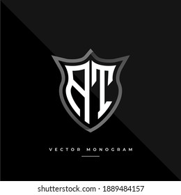 letters AT monochrome silver shield monogram vector logo template.