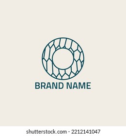 Letter-shaped circle logo with spider web texture.