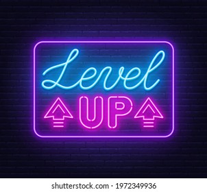 Level up neon sign on brick wall background.