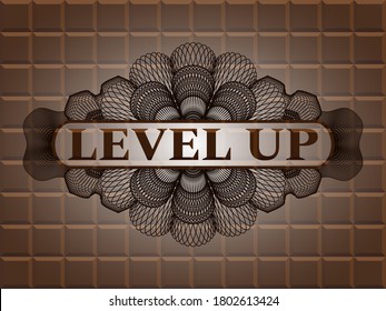 Level Up text inside Linear chocolate realistic emblem. Brown graceful background. Artistic illustration. 