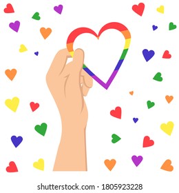 LGBT vector illustration.Concept for pride community. hand holding heart. Heart in rainbow colorful lines. A woman's hand holds a rainbow heart. Vector Illustration for logo,poster, card, 