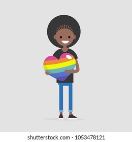 LGBTQ heart concept. Young female smiling character holding a big rainbow heart. Declaration of love. Flat editable vector illustration, clip art