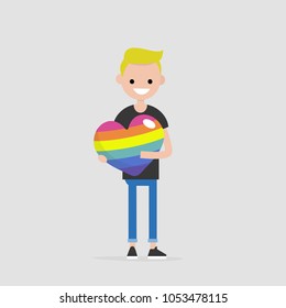 LGBTQ heart concept. Young smiling character holding a big rainbow heart. Declaration of love. Flat editable vector illustration, clip art