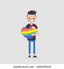 LGBTQ heart concept. Young smiling character holding a big rainbow heart. Declaration of love. Flat editable vector illustration, clip art