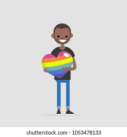 LGBTQ heart concept. Young smiling character holding a big rainbow heart. Declaration of love. Flat editable vector illustration, clip art