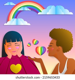 LGBTQ Pride Month. Cut colored paper, heart and woman couples blow a kiss symbolizing the month of pride. 