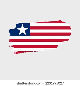 Liberia flag with grunge texture. Vector illustration of flag painted with brush with grunge effect and watercolor stroke. Happy Independence Day.