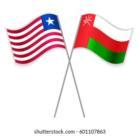 Liberian and Omani crossed flags. Liberia combined with Oman isolated on white. Language learning, international business or travel concept.
