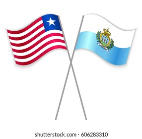 Liberian and Sammarinese crossed flags. Liberia combined with San Marino isolated on white. Language learning, international business or travel concept.