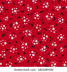Liberty pattern. Vector seamless texture with small pretty white flowers and black leaves on red backdrop. Elegant floral background. Simple ditsy pattern. Repeatable design for decor, textile, fabric