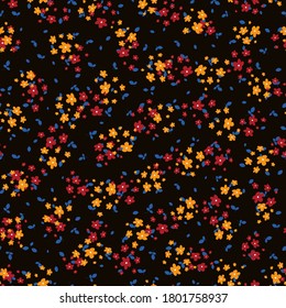 Liberty pattern. Vector seamless texture with small red, yellow flowers and blue leaves on black backdrop. Elegant floral background. Simple ditsy pattern. Repeatable design for decor, fabric, print