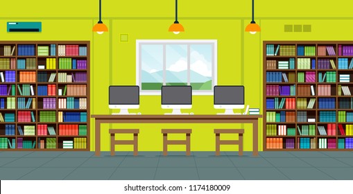 In the library with bookshelves and computers.