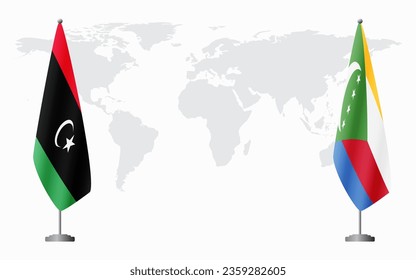 Libya and Comoros flags for official meeting against background of world map.