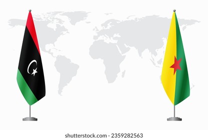 Libya and French Guiana flags for official meeting against background of world map.