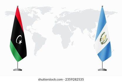 Libya and Guatemala flags for official meeting against background of world map.