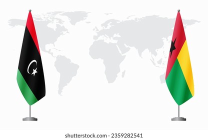 Libya and Guinea Bissau flags for official meeting against background of world map.