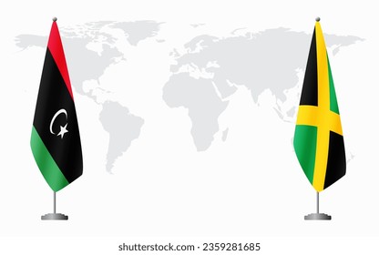 Libya and Jamaica flags for official meeting against background of world map.