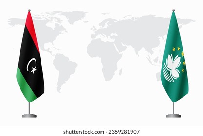 Libya and Macau flags for official meeting against background of world map.