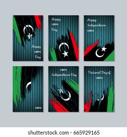 Libya Patriotic Cards for National Day. Expressive Brush Stroke in National Flag Colors on dark striped background. Libya Patriotic Vector Greeting Card.