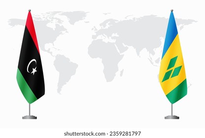 Libia y San Vicente y las Granadinas banderas para una reunión oficial contra el fondo del mapa mundial.