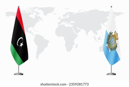 Libya and San Marino flags for official meeting against background of world map.