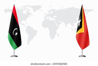 Libya and Timor-Leste flags for official meeting against background of world map.