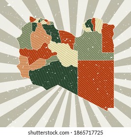 Libya vintage map. Grunge poster with map of the country in retro color palette. Shape of Libya with sunburst rays background. Vector illustration.