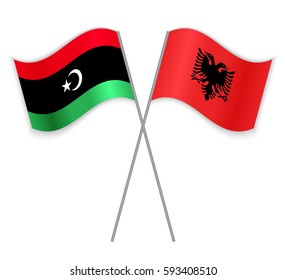Libyan and Albanian crossed flags. Libya combined with Albania isolated on white. Language learning, international business or travel concept.