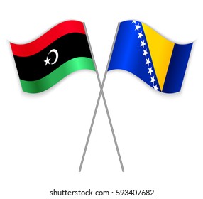 Libyan and Bosnian crossed flags. Libya combined with Bosnia and Herzegovina isolated on white. Language learning, international business or travel concept.