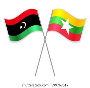 Libyan and Burmese crossed flags. Libya combined with Myanmar isolated on white. Language learning, international business or travel concept.