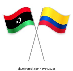 Libyan and Colombian crossed flags. Libya combined with Colombia isolated on white. Language learning, international business or travel concept.