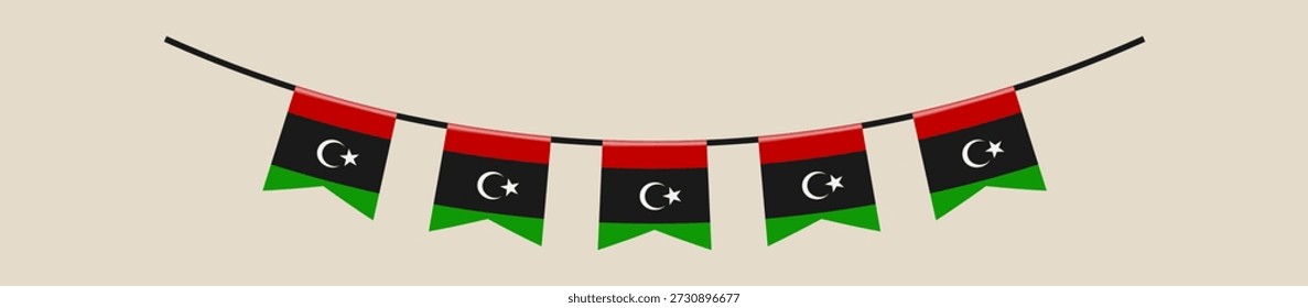 Die libysche Flagge hing an einer Schnur für eine Feier des Nationalfeiertags, die patriotischen Stolz und Geist zeigt.