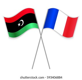 Libyan and French crossed flags. Libya combined with France isolated on white. Language learning, international business or travel concept.