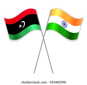 Libyan and Indian crossed flags. Libya combined with India isolated on white. Language learning, international business or travel concept.