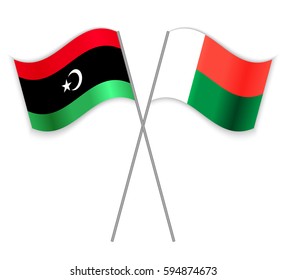Libyan and Malagasy crossed flags. Libya combined with Madagascar isolated on white. Language learning, international business or travel concept.