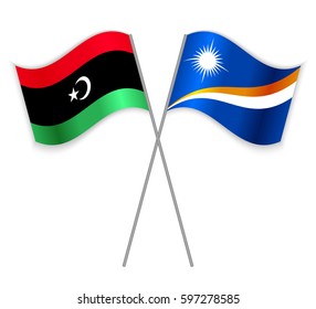 Libyan and Marshallese crossed flags. Libya combined with Marshall Islands isolated on white. Language learning, international business or travel concept.