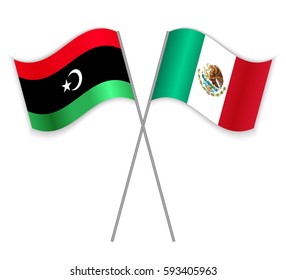 Libyan and Mexican crossed flags. Libya combined with Mexico isolated on white. Language learning, international business or travel concept.