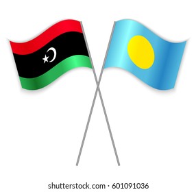 Libyan and Palauan crossed flags. Libya combined with Palau isolated on white. Language learning, international business or travel concept.